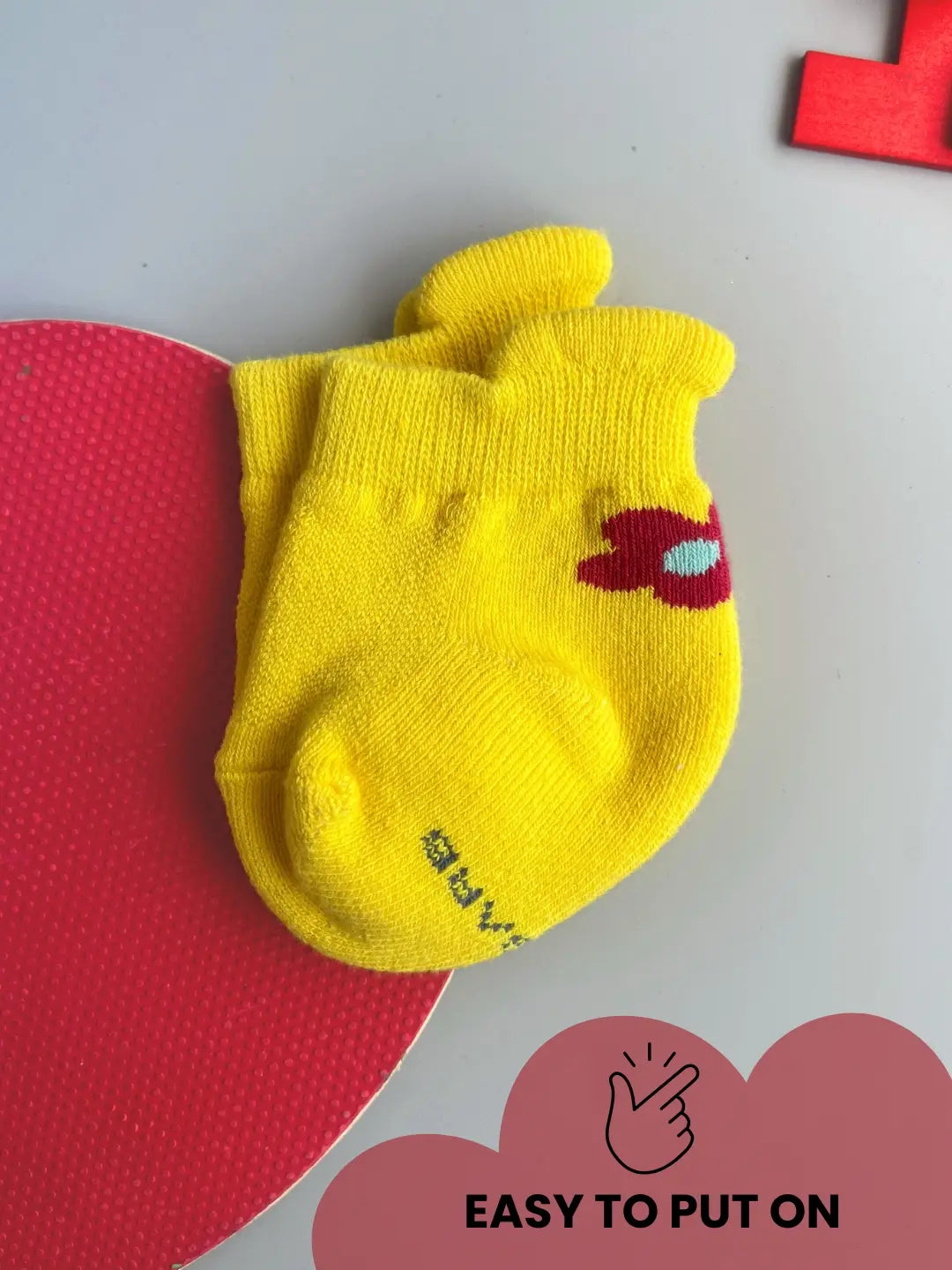 Air Garb baby combo socks set with a small flower design on the side; includes pairs of soft cotton socks in mint green, bright pink, and sunny yellow for babies 0-1 years.