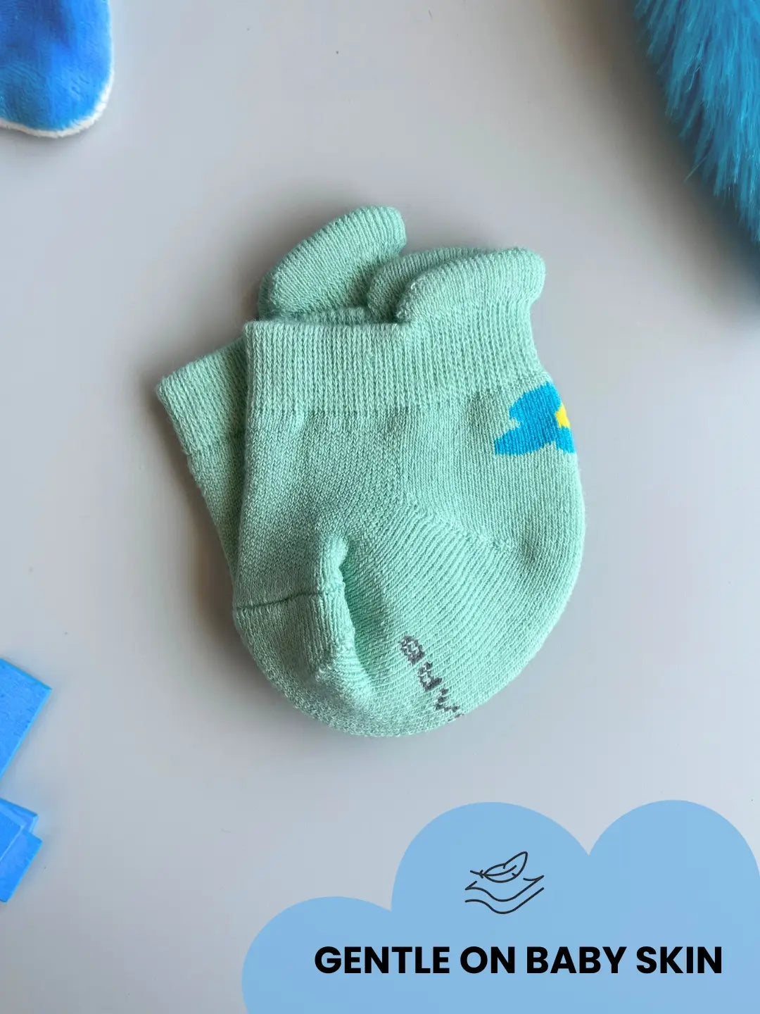Air Garb baby combo socks set with a small flower design on the side; includes pairs of soft cotton socks in mint green, bright pink, and sunny yellow for babies 0-1 years.